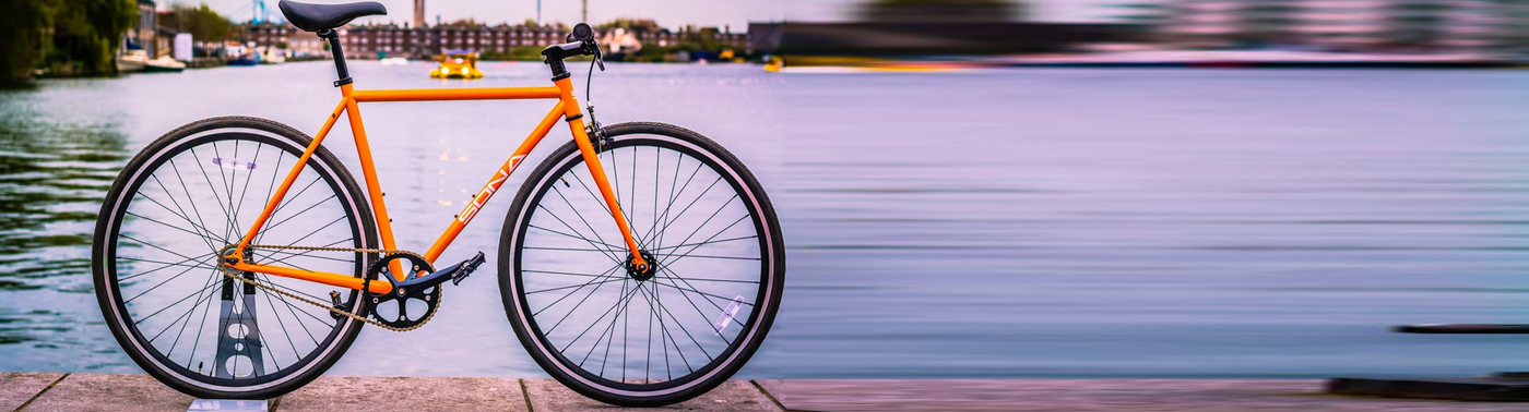 Orange fixie best sale bike